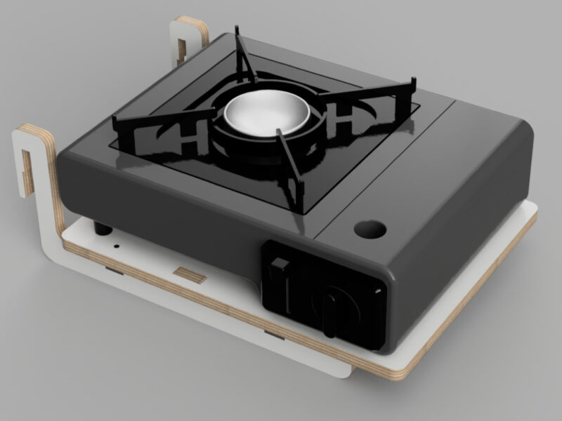 Fornello da campeggio compatto con griglia nera e base robusta, ideale per la preparazione di cibi all'aperto.
