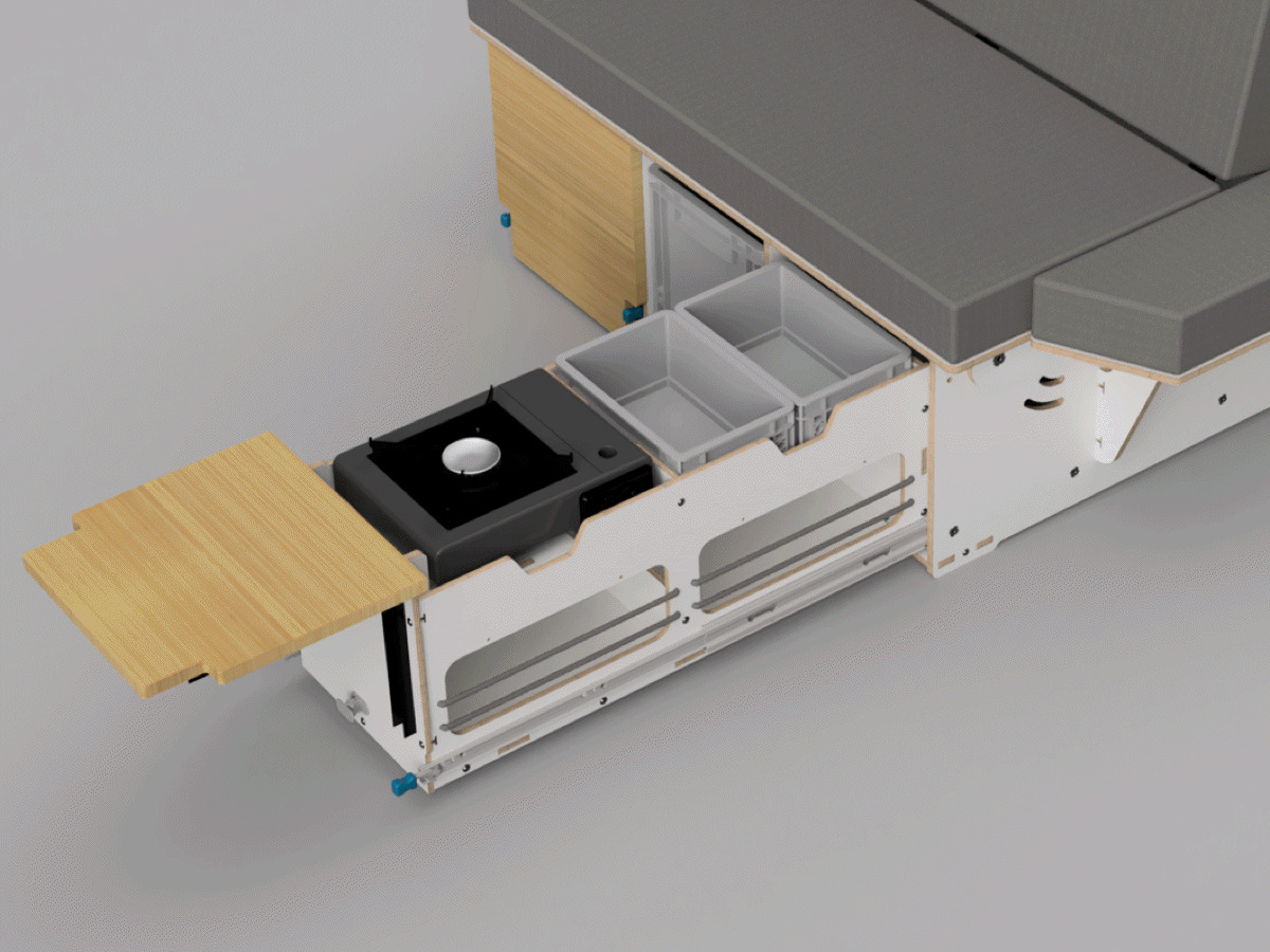 The picture shows an innovative camping module with a pull-out kitchen area that offers a hob and several storage compartments for camping utensils.